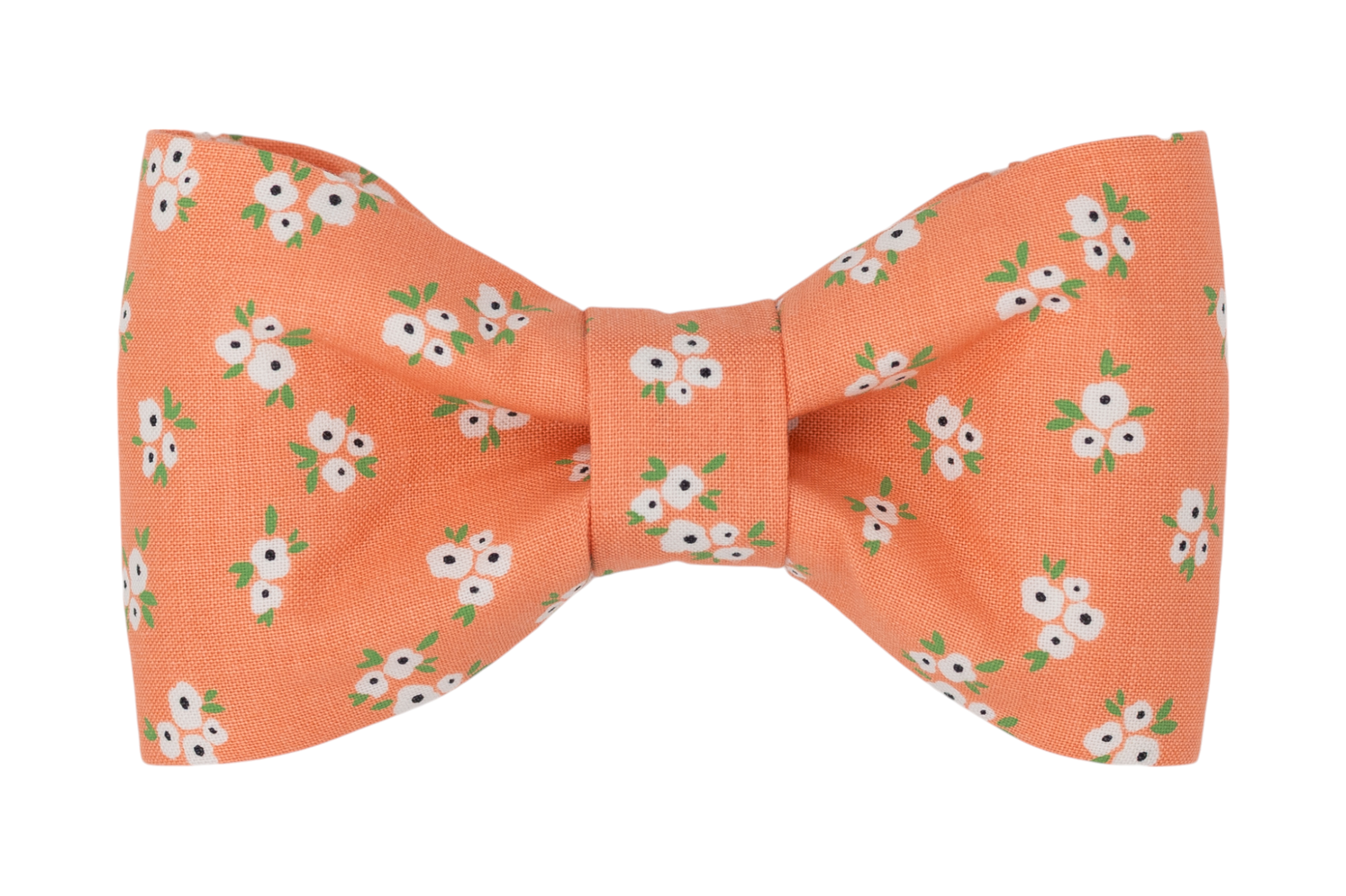Handmade dog bow tie in a warm coral-orange color, adorned with a scattered pattern of small white flowers with green leaves.