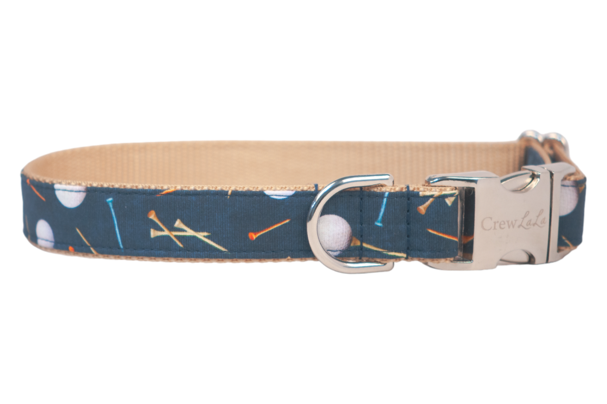 A navy blue adjustable dog collar with a fun golf-themed print, featuring white golf balls and multicolored tees in orange, yellow, and blue. The outer fabric wraps around a tan woven nylon interior for added durability. The collar includes a silver metal D-ring for leash attachment and a sturdy metal side-release buckle engraved with the brand name “Crew LaLa.” The collar design combines sporty style with functional hardware.