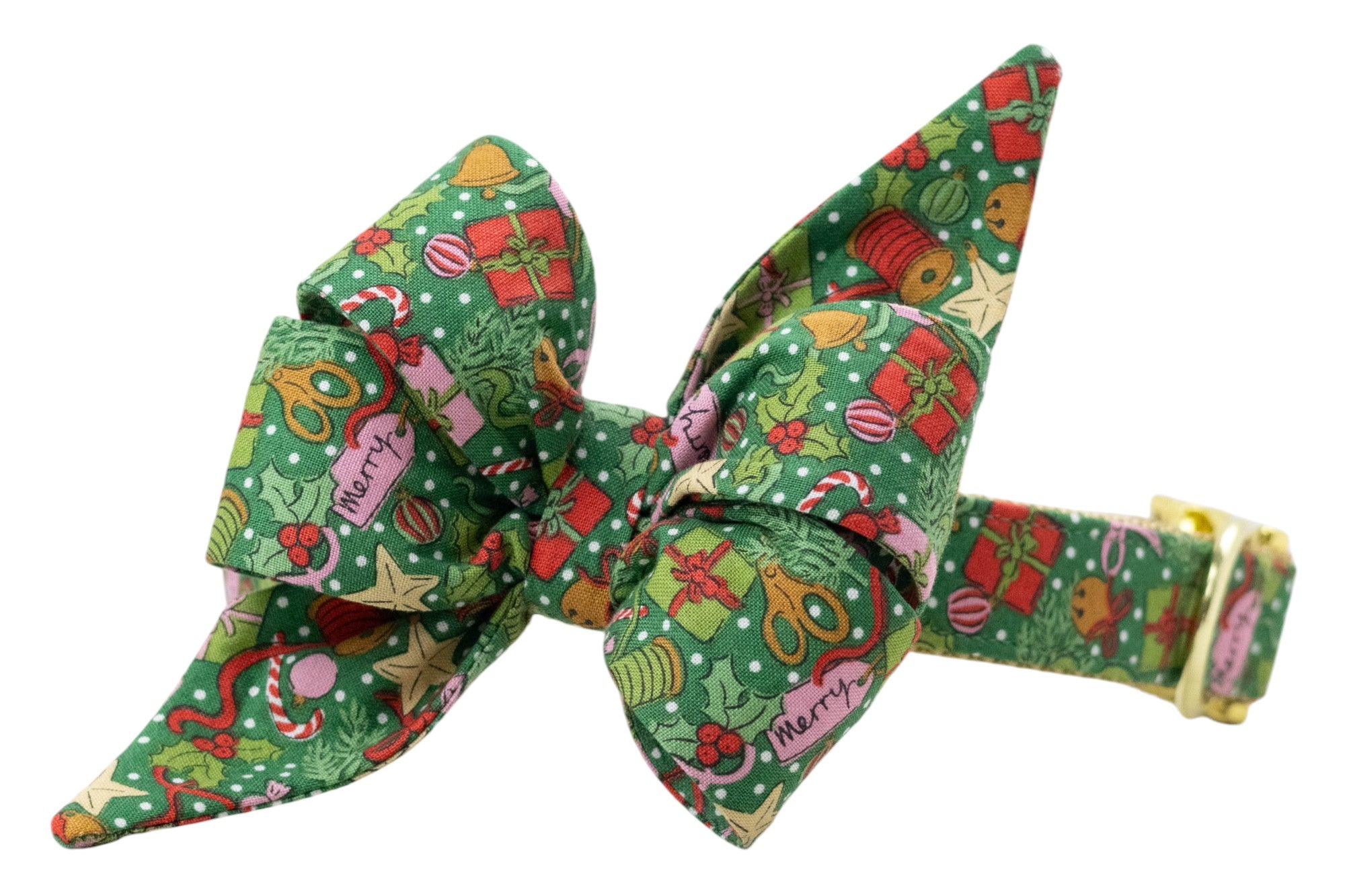 Festive green dog collar with a decorative,  matching belle bow, covered in a colorful holiday print of gifts, holly, bells, candy canes, and ornaments. Finished with shiny hardware for a polished, seasonal look.