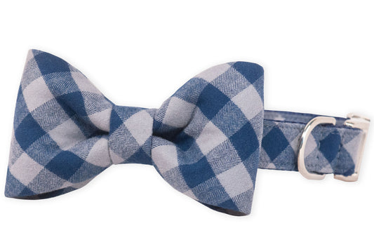 A dapper dog collar with a crisp, matching navy plaid bow tie, perfect for pups who love to dress to impress. Features metal hardware and an adjustable fit for everyday charm.