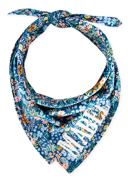 Make every walk a wildflower moment with this tie-on dog bandana, bursting with colorful blooms on a navy background—fresh, fun, and photo-ready! The name "Mabel" is embroidered on the bottom right.