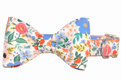 A charming dog collar with a matching floral bow tie in vivid summer florals and a silver buckle, perfect for a dressed-up pup.